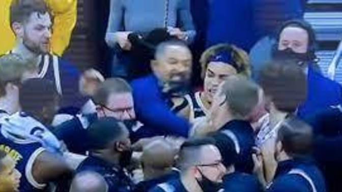 Juwan Howard (fab five) coach of Michigan punched another Coach on Wisconsin today after Basket ball game, what happens?