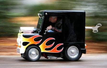 MY NEW CAR. I HAVE TO GET OUT AT EVERY TRAFFIC LIGHT AND WIND IT UP.