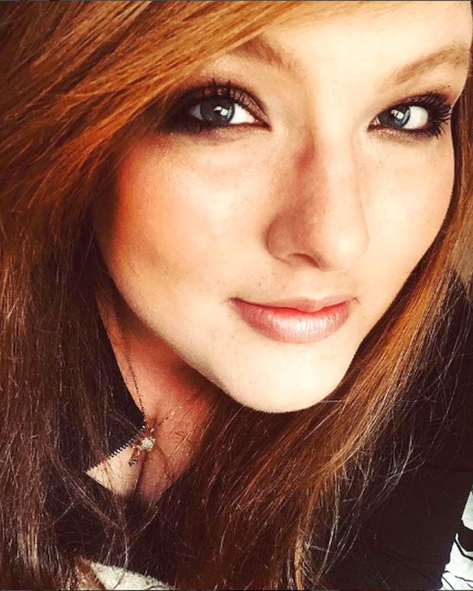FACE: Ginger hair with pale skin and nice lips.