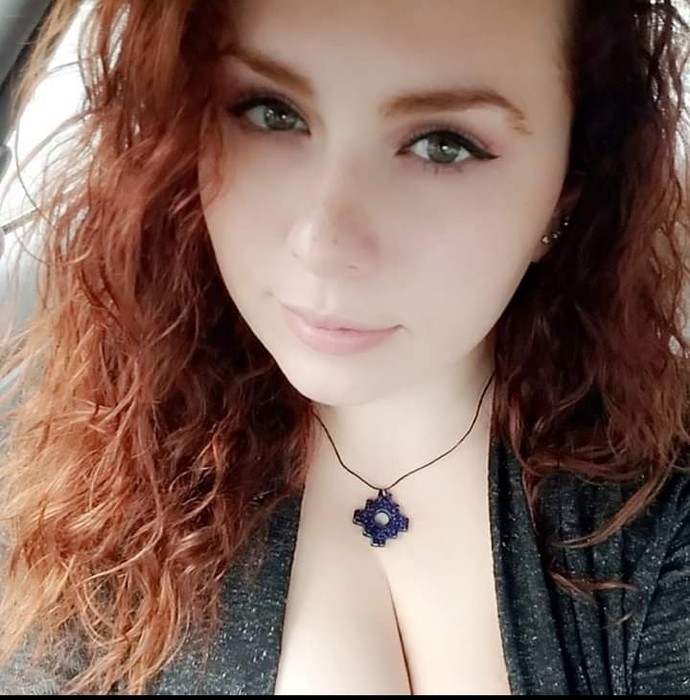 FACE: Red hair with pale skin and nice lips.