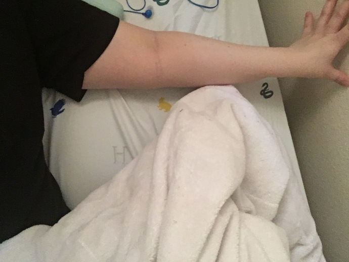 I didn’t move and extended my arm to show the rest of the bed size