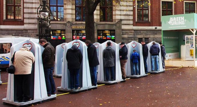 Guys, I saw 2 images on the net of guys standing at a urinal next to other guys with their pants down to their knees, is this common?