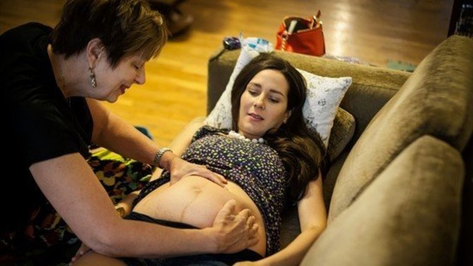 Wife wants to give birth without any medical intervention. How much can I say without stepping over the line?