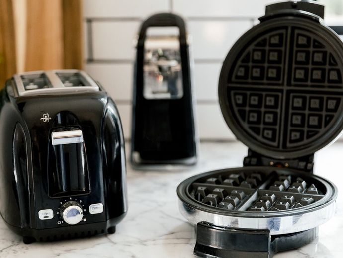 How can I clean my kitchen appliances and remove the grease?