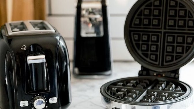 How can I clean my kitchen appliances and remove the grease?
