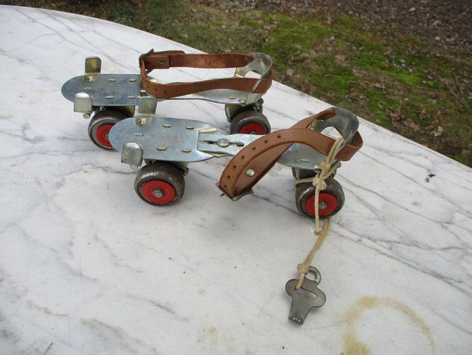 Old metal wheel slip on roller skates