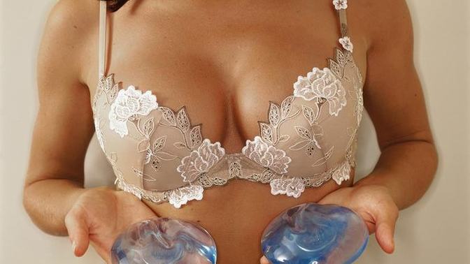 Girls, why do women get breast augmentation surgery, then complain about men staring at their breasts?