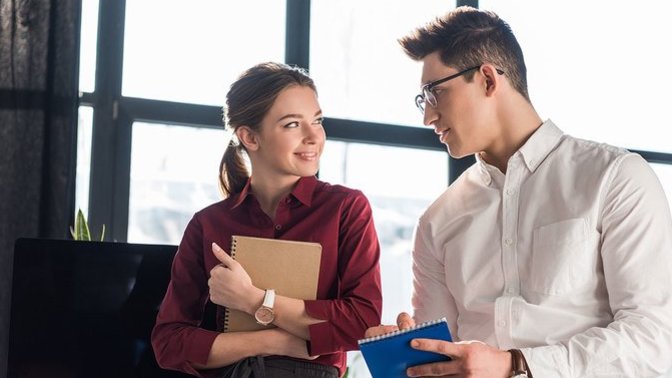 What are good indicators that a co-worker is flirting vs. just being friendly?
