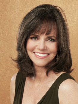 She needed her hair down in a face-framing long bob- much nicer. 