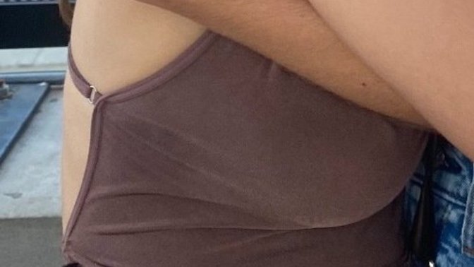 Can you tell if she is wearing a bra?