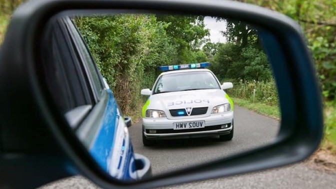 How do you feel when you see a police car in your rear view mirror?