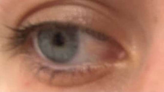 Do you think her eyes are blue or green?