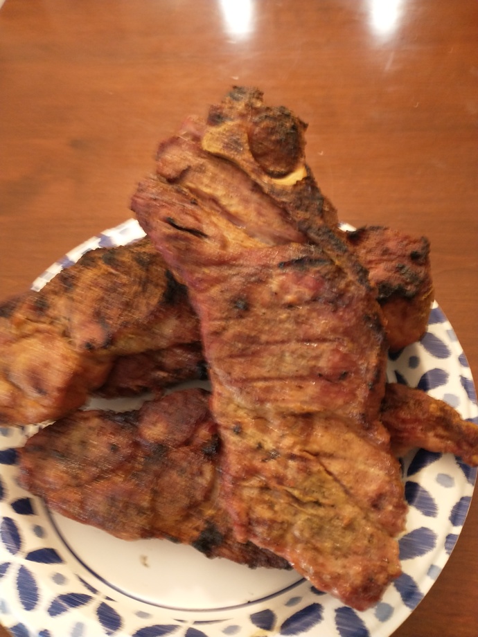 Is cooking meat on a grill a "man's job"?