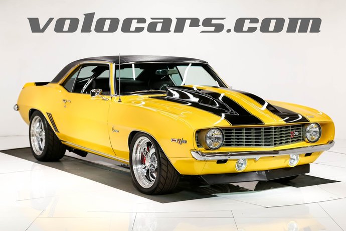 Which of these yellow, orange, white cars for sale by volocars is your favorite?