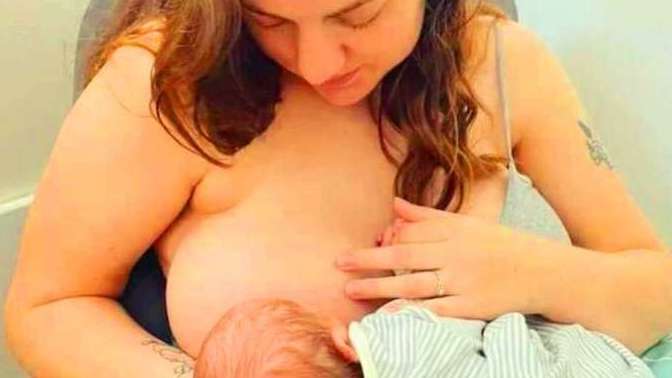 In front of whom can a mother breastfeed without cover?