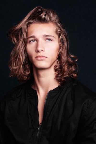 Is he more handsome with short hair or long hair?