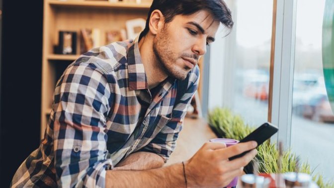 Why does he stare and then look at his phone?