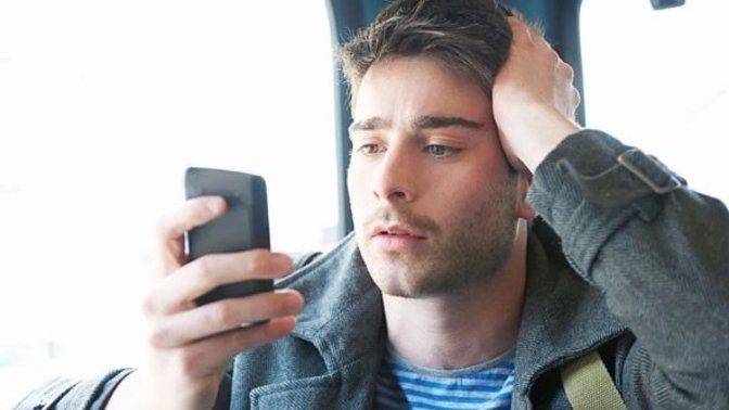 Why would a guy stare at me and then focus on his phone?