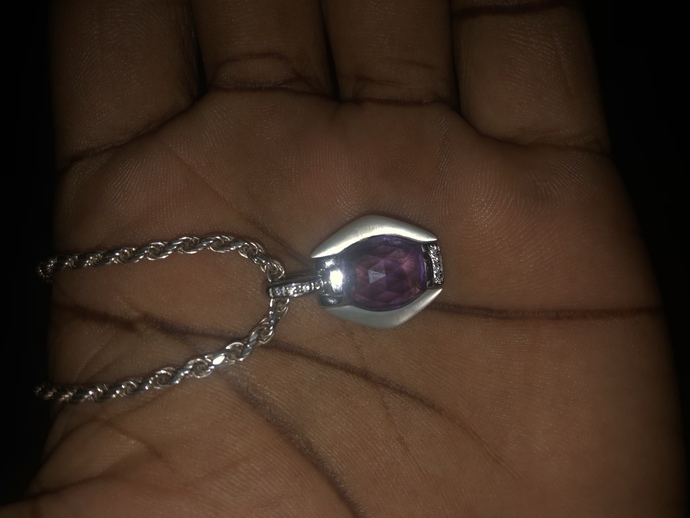 I I bought this some days ago but I’m trying to figure out if my diamonds are real , plus there is a stamp that I’m trying to figure out cc?