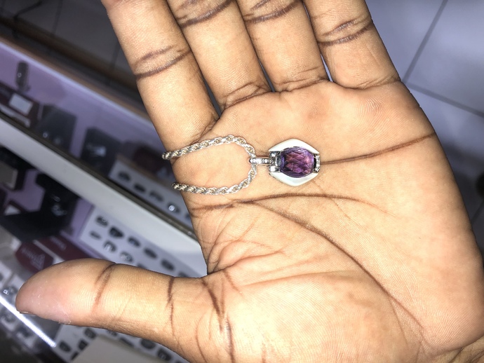 I I bought this some days ago but I’m trying to figure out if my diamonds are real , plus there is a stamp that I’m trying to figure out cc?