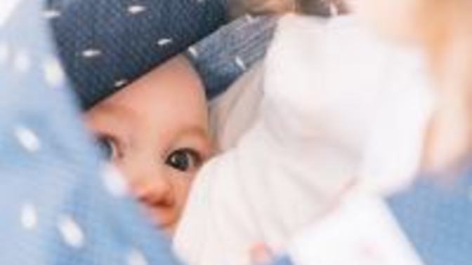 What do you think of women who use cover-ups while breastfeeding in public?
