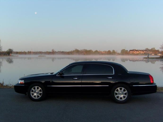 Whats a better girlfriend material car, a 2011 Kia Rio LX or a 2011 Lincoln Town Car Executive L?