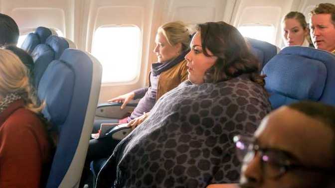 Should people over a certain size and weight be compelled to buy 2 airline seats to stop them from encroaching in other passengers space?