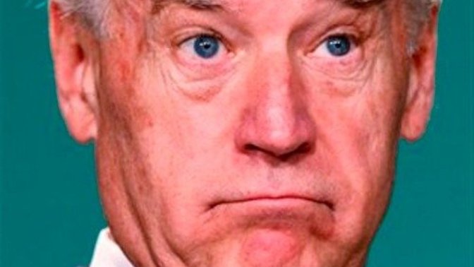 What does Biden snack on in bed at night as he watches the news?