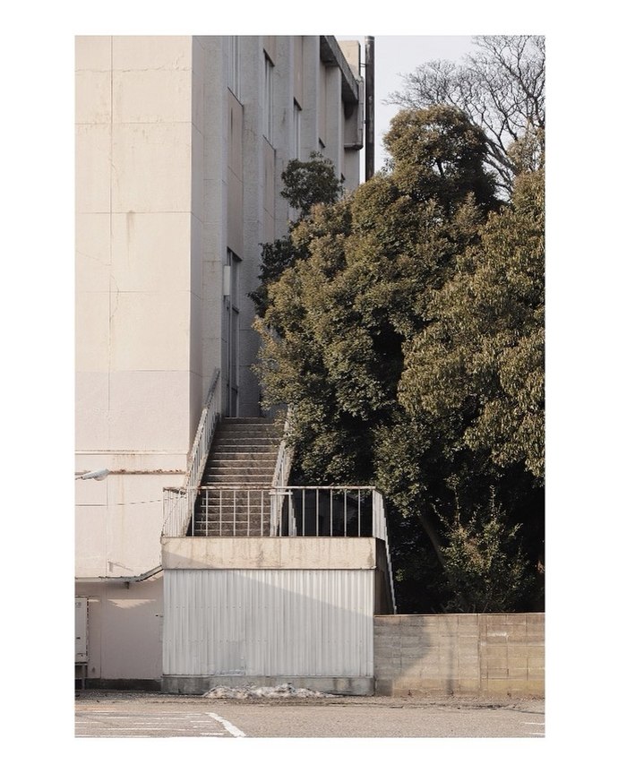 Why do some people take photos of everyday objects when they travel?