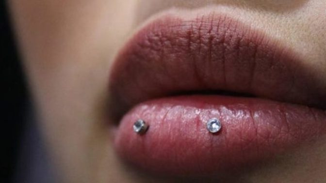 Which piercing would look good on a round-shaped face?