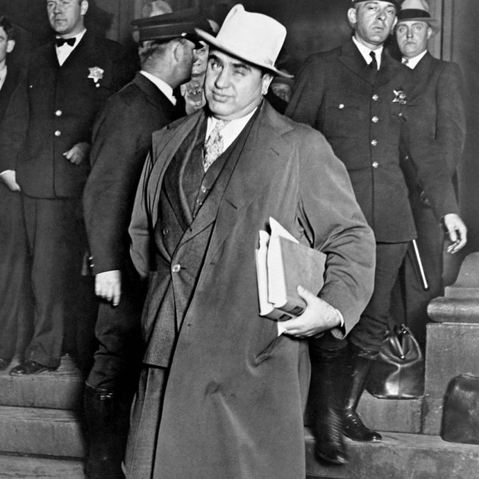 Why are gangsters like Al Capone glorified?