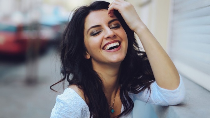 What does it mean when a girl constantly laughs around you?
