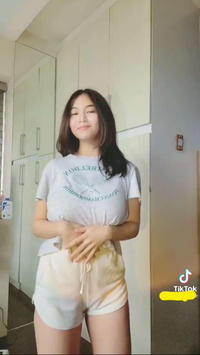 Is she busty based on these photos alone or she just makes it look big by wearing padding, etc. ?