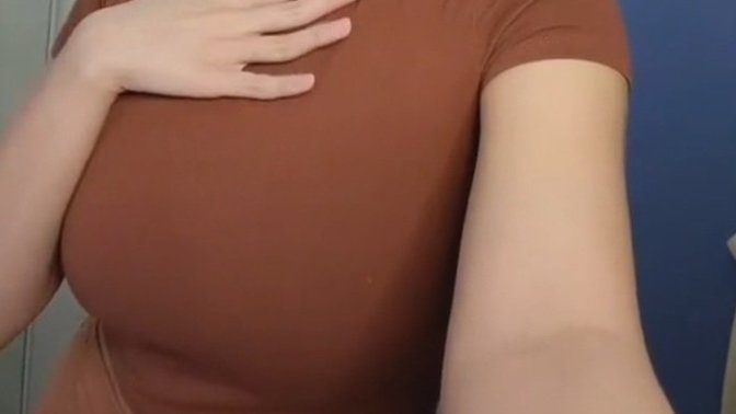 Is she busty based on these photos alone or she just makes it look big by wearing padding, etc. ?