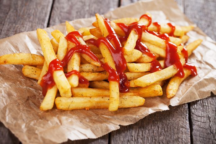 When you eat fries with ketchup, do you pour the ketchup on the fries, or next to them?