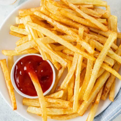 When you eat fries with ketchup, do you pour the ketchup on the fries, or next to them?