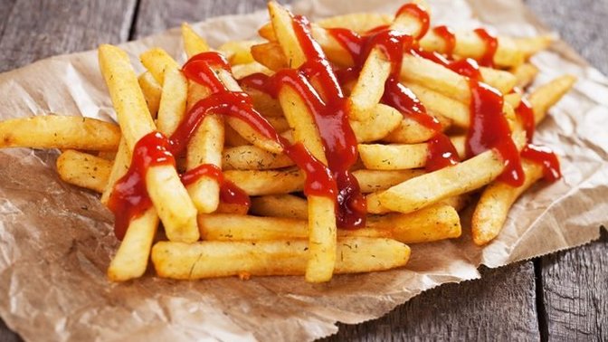 When you eat fries with ketchup, do you pour the ketchup on the fries, or next to them?