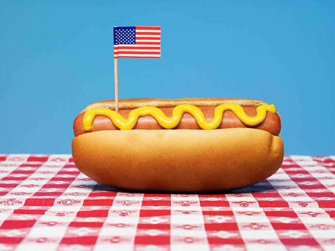 Why are hot dogs called hot dogs when they don’t contain any dog meat?