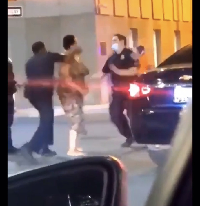 This lady punched a cop twice and got knocked out. Did she deserve it?