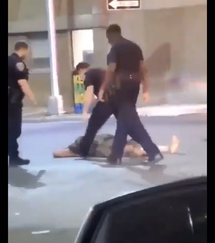 This lady punched a cop twice and got knocked out. Did she deserve it?