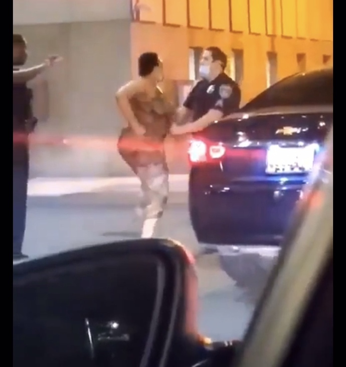 This lady punched a cop twice and got knocked out. Did she deserve it?
