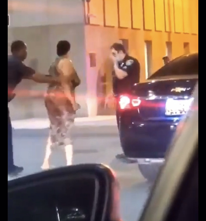 This lady punched a cop twice and got knocked out. Did she deserve it?