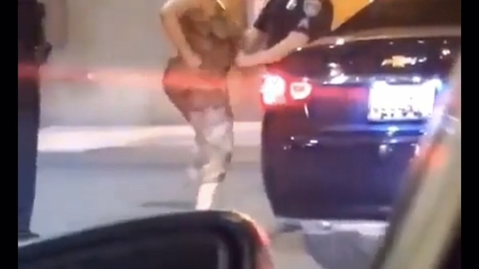 This lady punched a cop twice and got knocked out. Did she deserve it?