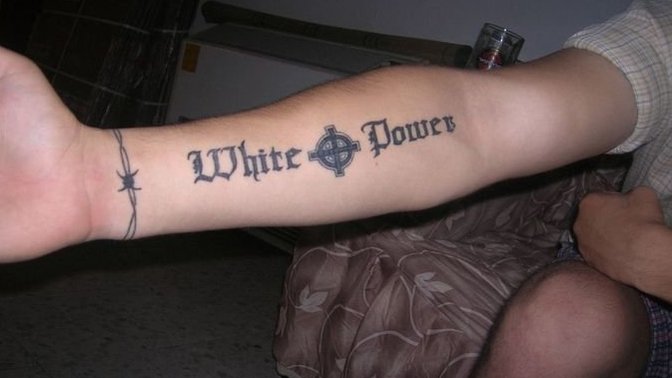 If someone has a White Power tattoo does that “necessarily” mean racism?