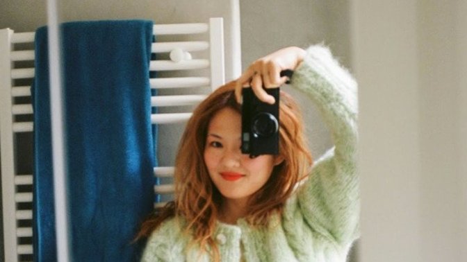 Why do people take selfies with their phones in a mirror. What's the motive?