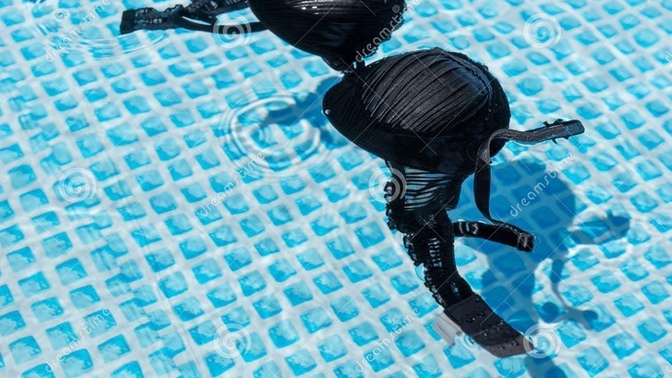 Can a girl just decide to remove her bra to get more comfortable while swimming around kids and families?