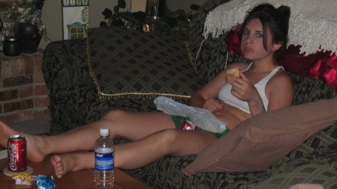 What is she eating and what would you say the theme of this photo was?