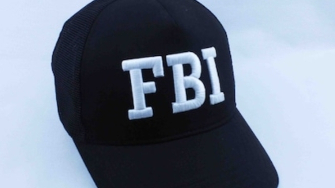 What happens if I wear an FBI hat in America?