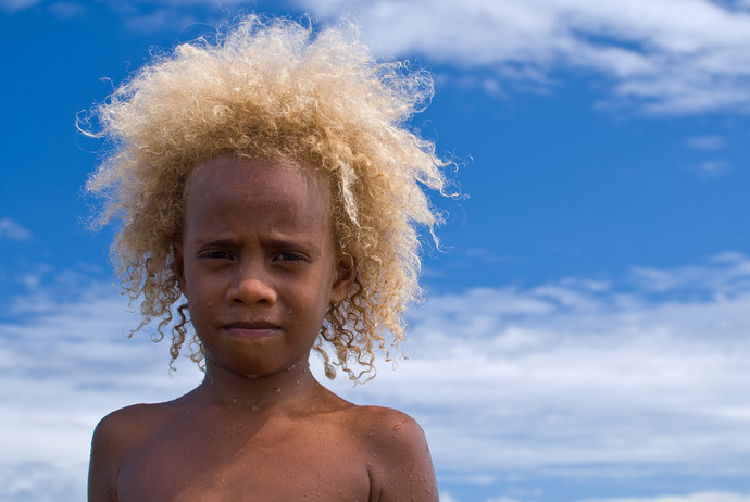 Can black people be born with blonde hair?