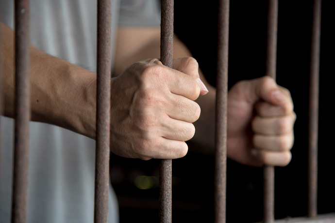 Is it a violation of prison rules to snitch on guards?